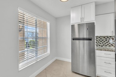 Beautifully updated and spacious 55+ ground-floor condo with no on Villa Del Ray Golf Club in Florida - for sale on GolfHomes.com, golf home, golf lot