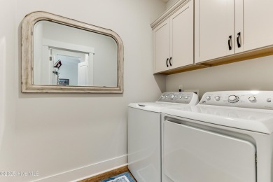 This gorgeous townhome resides in the Smithfield III section of on Brunswick Plantation and Golf Resorts in North Carolina - for sale on GolfHomes.com, golf home, golf lot