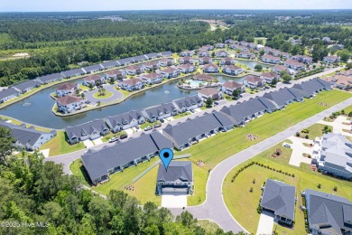 This gorgeous townhome resides in the Smithfield III section of on Brunswick Plantation and Golf Resorts in North Carolina - for sale on GolfHomes.com, golf home, golf lot