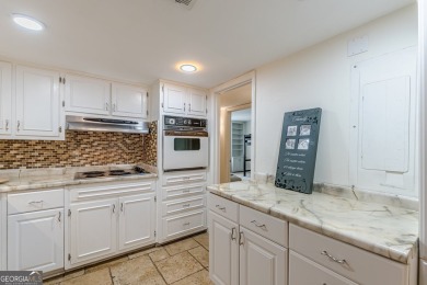 Welcome to this beautifully maintained all-brick townhome that on Dunwoody Country Club in Georgia - for sale on GolfHomes.com, golf home, golf lot