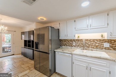 Welcome to this beautifully maintained all-brick townhome that on Dunwoody Country Club in Georgia - for sale on GolfHomes.com, golf home, golf lot