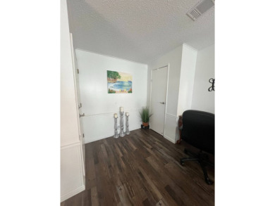 Welcome to this well-maintained and mostly furnished home in a on Lake Henry Golf Club in Florida - for sale on GolfHomes.com, golf home, golf lot