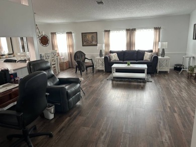 Welcome to this well-maintained and mostly furnished home in a on Lake Henry Golf Club in Florida - for sale on GolfHomes.com, golf home, golf lot