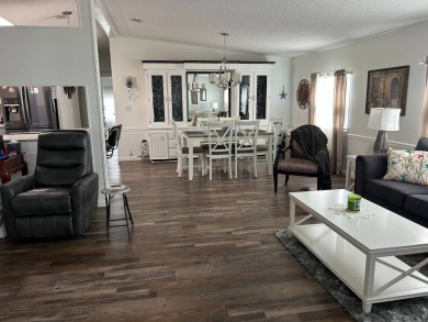 Welcome to this well-maintained and mostly furnished home in a on Lake Henry Golf Club in Florida - for sale on GolfHomes.com, golf home, golf lot