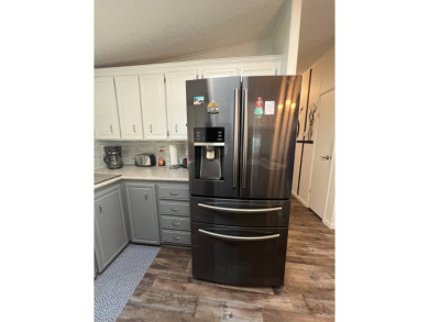 Welcome to this well-maintained and mostly furnished home in a on Lake Henry Golf Club in Florida - for sale on GolfHomes.com, golf home, golf lot