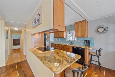 Under contract-accepting backup offers. Welcome home to easy on Pelican Pointe Golf and Country Club in Florida - for sale on GolfHomes.com, golf home, golf lot