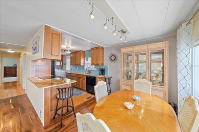 Under contract-accepting backup offers. Welcome home to easy on Pelican Pointe Golf and Country Club in Florida - for sale on GolfHomes.com, golf home, golf lot