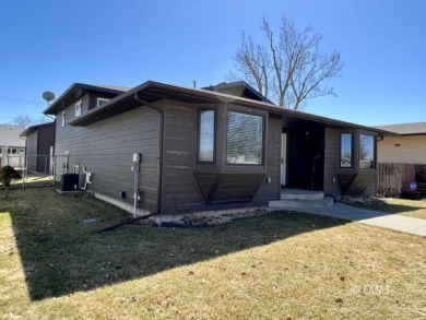 This fully remodeled two-unit condo comes with all the bells and on Miles City Town and Country Club in Montana - for sale on GolfHomes.com, golf home, golf lot