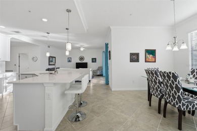 Discover elevated maintenance free Florida living in this on Sarasota National Golf Club in Florida - for sale on GolfHomes.com, golf home, golf lot