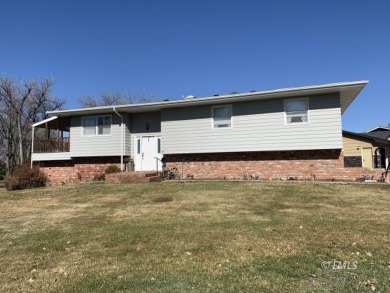 This charming raised ranch home sits on a quiet cul-de-sac that on Miles City Town and Country Club in Montana - for sale on GolfHomes.com, golf home, golf lot