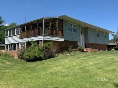 This charming raised ranch home sits on a quiet cul-de-sac that on Miles City Town and Country Club in Montana - for sale on GolfHomes.com, golf home, golf lot