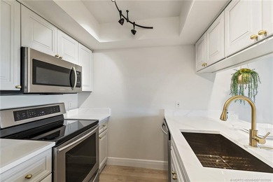 Enjoy sunny, wide views of the lake & golf course from the on Ocean Club At the Hutchinson Island Beach Resort in Florida - for sale on GolfHomes.com, golf home, golf lot