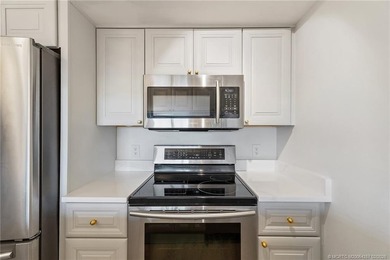 Enjoy sunny, wide views of the lake & golf course from the on Ocean Club At the Hutchinson Island Beach Resort in Florida - for sale on GolfHomes.com, golf home, golf lot