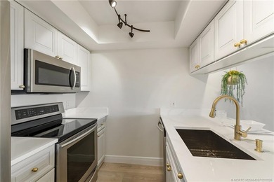 Enjoy sunny, wide views of the lake & golf course from the on Ocean Club At the Hutchinson Island Beach Resort in Florida - for sale on GolfHomes.com, golf home, golf lot