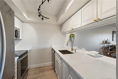 Enjoy sunny, wide views of the lake & golf course from the on Ocean Club At the Hutchinson Island Beach Resort in Florida - for sale on GolfHomes.com, golf home, golf lot