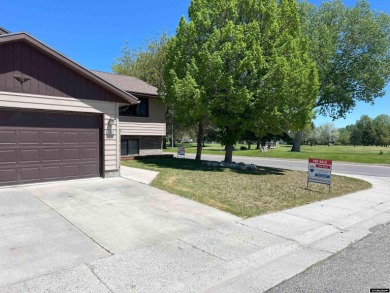 Nestled in the serene ambiance of the prestigious golf course on Riverton Country Club in Wyoming - for sale on GolfHomes.com, golf home, golf lot