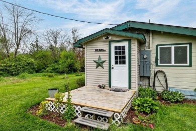At the end of a quiet private road, sits this charming cedar on Alburg Golf Links in Vermont - for sale on GolfHomes.com, golf home, golf lot