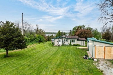 At the end of a quiet private road, sits this charming cedar on Alburg Golf Links in Vermont - for sale on GolfHomes.com, golf home, golf lot