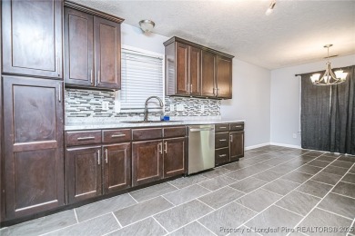 Welcome to this inviting 3-bedroom, 2-bathroom home nestled in on Hope Mills Golf and Country Club in North Carolina - for sale on GolfHomes.com, golf home, golf lot