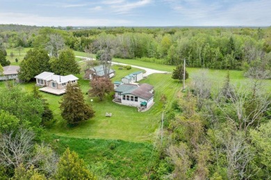 At the end of a quiet private road, sits this charming cedar on Alburg Golf Links in Vermont - for sale on GolfHomes.com, golf home, golf lot