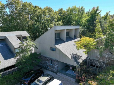 This FURNISHED Eden Isle townhome is right across the street on Red Apple Inn and Country Club in Arkansas - for sale on GolfHomes.com, golf home, golf lot