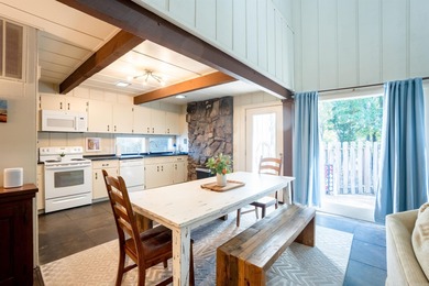 This FURNISHED Eden Isle townhome is right across the street on Red Apple Inn and Country Club in Arkansas - for sale on GolfHomes.com, golf home, golf lot