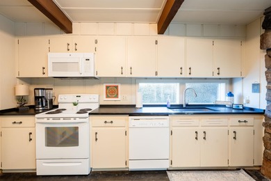 This FURNISHED Eden Isle townhome is right across the street on Red Apple Inn and Country Club in Arkansas - for sale on GolfHomes.com, golf home, golf lot