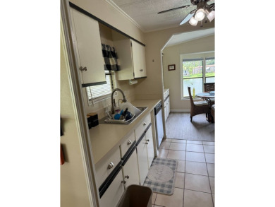 This lovely, home is in an age 55+ community but age 40+ is on Pine Lakes Country Club in Florida - for sale on GolfHomes.com, golf home, golf lot