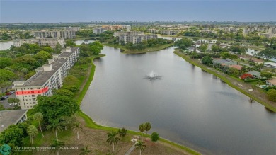 SPECTACULAR WATER VIEWS! Looking for a move in ready condo w/ a on Palm-Aire Country Club and Resort - Palms in Florida - for sale on GolfHomes.com, golf home, golf lot