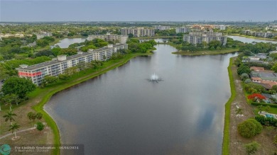 SPECTACULAR WATER VIEWS! Looking for a move in ready condo w/ a on Palm-Aire Country Club and Resort - Palms in Florida - for sale on GolfHomes.com, golf home, golf lot