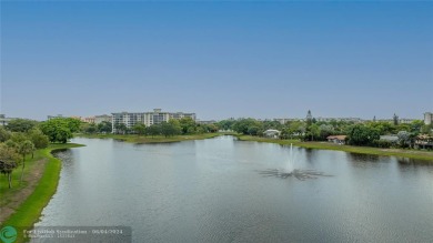 SPECTACULAR WATER VIEWS! Looking for a move in ready condo w/ a on Palm-Aire Country Club and Resort - Palms in Florida - for sale on GolfHomes.com, golf home, golf lot