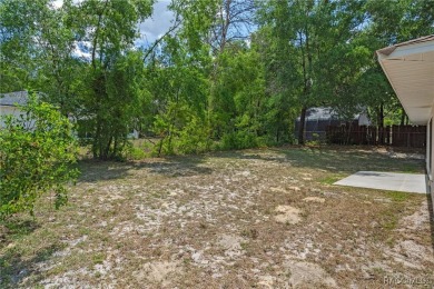 Located in the heart of Citrus Springs, 1574 W Lavender Lane on Citrus Springs Country Club in Florida - for sale on GolfHomes.com, golf home, golf lot