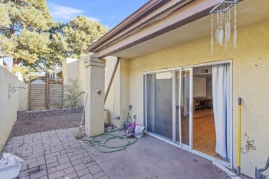 Discover this easy-to-maintain 2-bedroom, 2-bathroom patio home on Arroyo Del Oso Golf Course in New Mexico - for sale on GolfHomes.com, golf home, golf lot