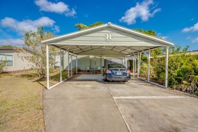 This unique two-bedroom, two-bath home in the gated, golf-course on Lake Fairways Country Club in Florida - for sale on GolfHomes.com, golf home, golf lot