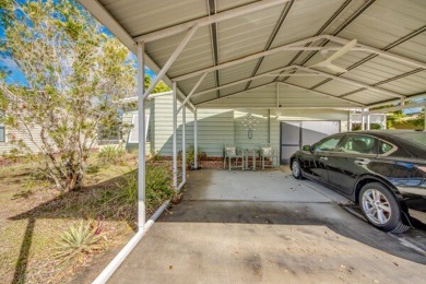 This unique two-bedroom, two-bath home in the gated, golf-course on Lake Fairways Country Club in Florida - for sale on GolfHomes.com, golf home, golf lot