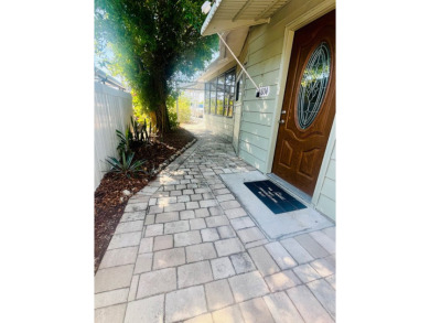 This unique two-bedroom, two-bath home in the gated, golf-course on Lake Fairways Country Club in Florida - for sale on GolfHomes.com, golf home, golf lot