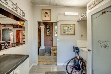 This unique two-bedroom, two-bath home in the gated, golf-course on Lake Fairways Country Club in Florida - for sale on GolfHomes.com, golf home, golf lot