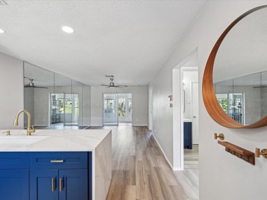 Completely updated, luxurious unit located within the gates of on Seven Springs Golf and Country Club in Florida - for sale on GolfHomes.com, golf home, golf lot