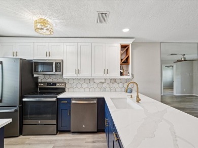 Completely updated, luxurious unit located within the gates of on Seven Springs Golf and Country Club in Florida - for sale on GolfHomes.com, golf home, golf lot