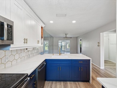 Completely updated, luxurious unit located within the gates of on Seven Springs Golf and Country Club in Florida - for sale on GolfHomes.com, golf home, golf lot