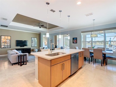 STUNNING & SPOTLESS CABELLA model with a heated Salt Water POOL on Stonegate Golf Club in Florida - for sale on GolfHomes.com, golf home, golf lot