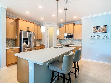 STUNNING & SPOTLESS CABELLA model with a heated Salt Water POOL on Stonegate Golf Club in Florida - for sale on GolfHomes.com, golf home, golf lot