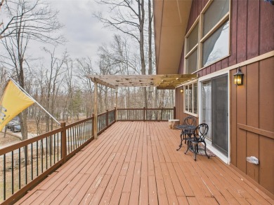 Welcome to this delightful 3-bedroom, 2-bath chalet packed with on Michaywe Pines Course in Michigan - for sale on GolfHomes.com, golf home, golf lot