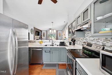 Welcome to 5351 Cog Hill Court, a rare end-unit townhome in the on Hedingham Golf and Athletic Club in North Carolina - for sale on GolfHomes.com, golf home, golf lot