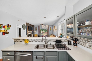 Welcome to 5351 Cog Hill Court, a rare end-unit townhome in the on Hedingham Golf and Athletic Club in North Carolina - for sale on GolfHomes.com, golf home, golf lot