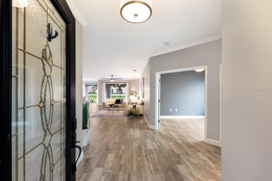 Step inside this classy 3 bedroom 2 bath home with views of the on Stoneybrook Golf Club At Heritage Harbour in Florida - for sale on GolfHomes.com, golf home, golf lot