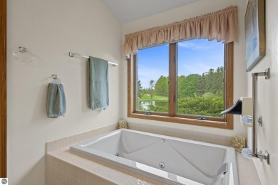 Beautiful 3-bedroom, 2.5-bath ranch home located on the 14th on Grand Traverse Resort and Spa in Michigan - for sale on GolfHomes.com, golf home, golf lot