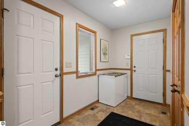 Beautiful 3-bedroom, 2.5-bath ranch home located on the 14th on Grand Traverse Resort and Spa in Michigan - for sale on GolfHomes.com, golf home, golf lot