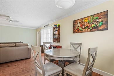 Enjoy easy Florida living in this 2BR/2BA FIRST-FLOOR unit with on The American Golf Club in Florida - for sale on GolfHomes.com, golf home, golf lot