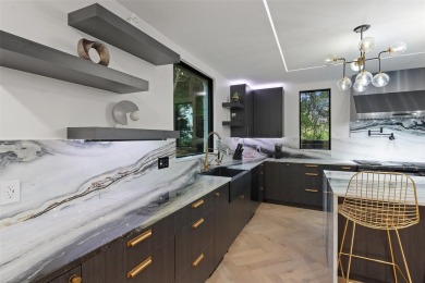 Bold, sophisticated, and move-in ready -- this natural modern on Austin Country Club in Texas - for sale on GolfHomes.com, golf home, golf lot